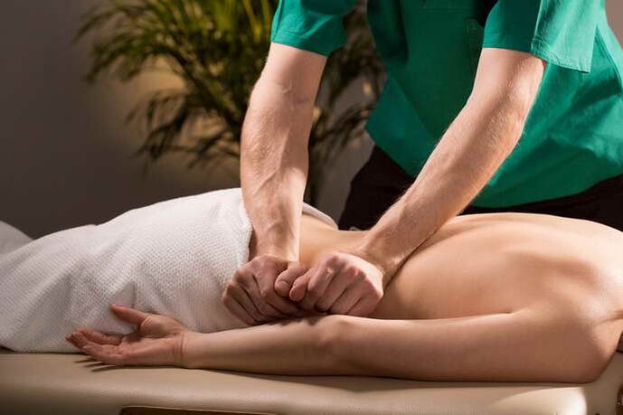 Massage of patient with osteochondrosis